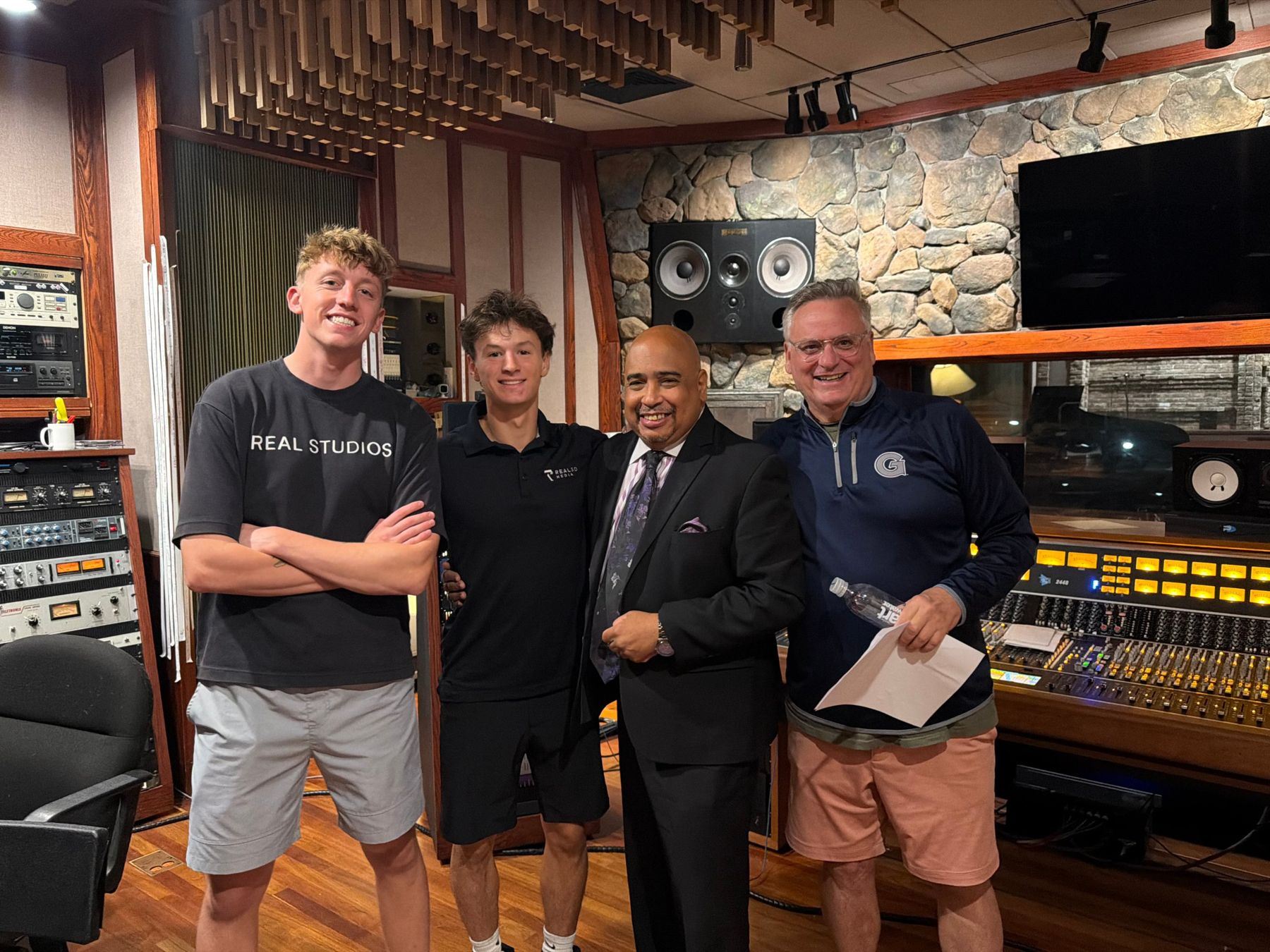 Carter Mezzio and Quinn Vankerkhove of Real3D Media with Paul Boutte and Peter Bianco in a studio control room