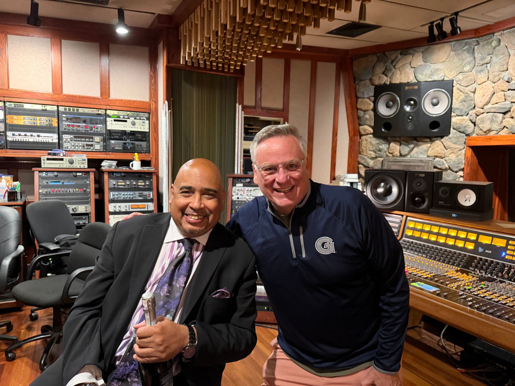 Paul Boutte and Peter Bianco in a studio control room beside the mixing console